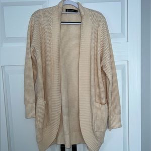 Beige cardigan.